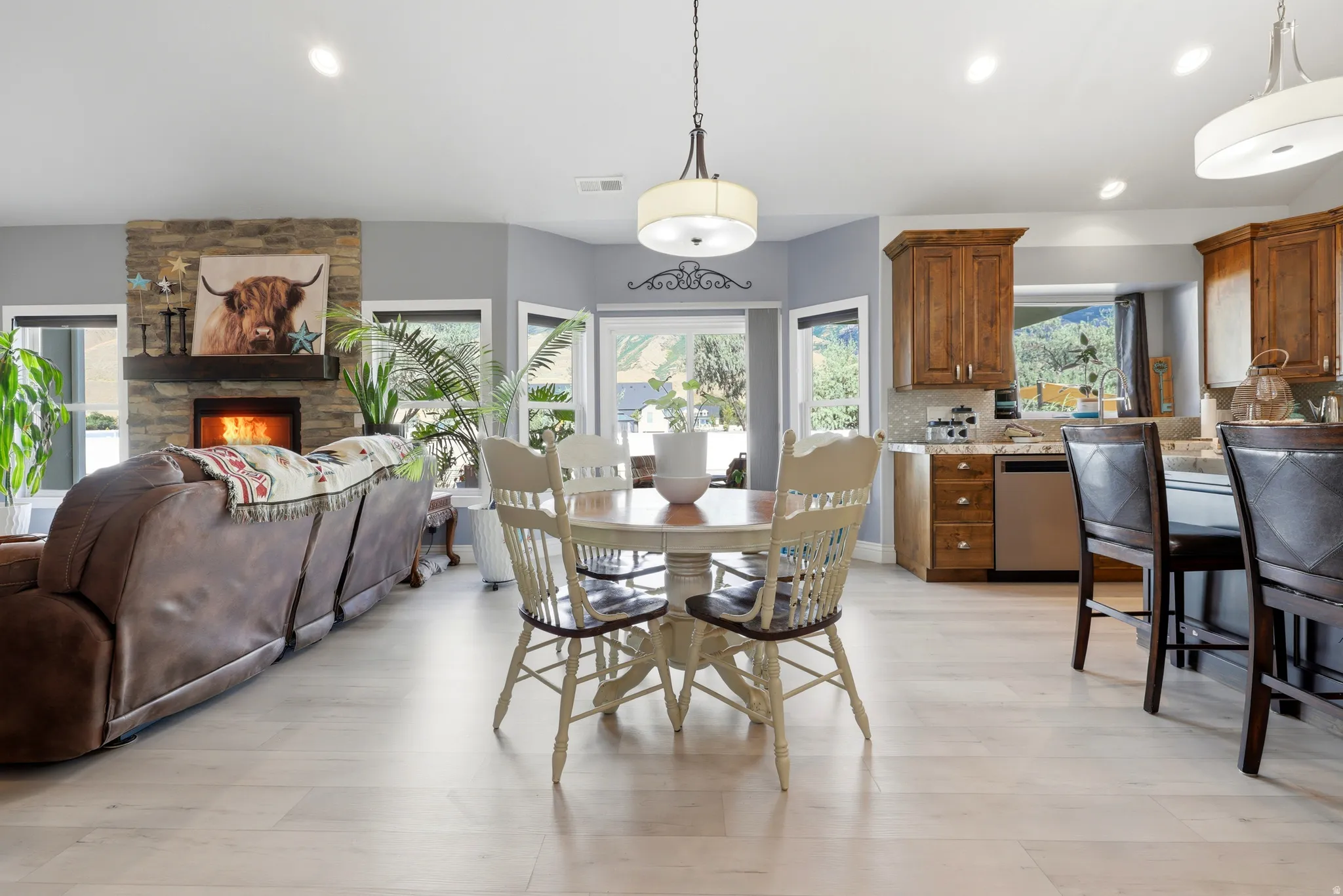 Open-concept living space with light wood-finish flooring