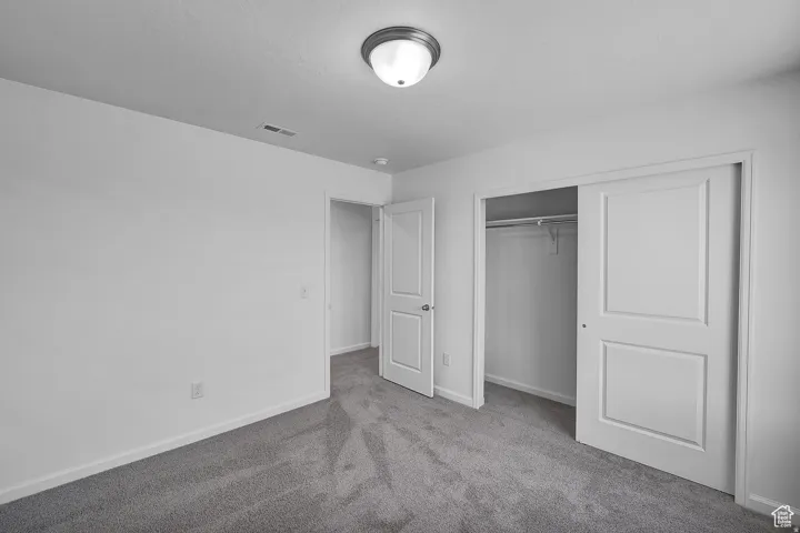 Room featuring neutral gray carpeting and white walls
