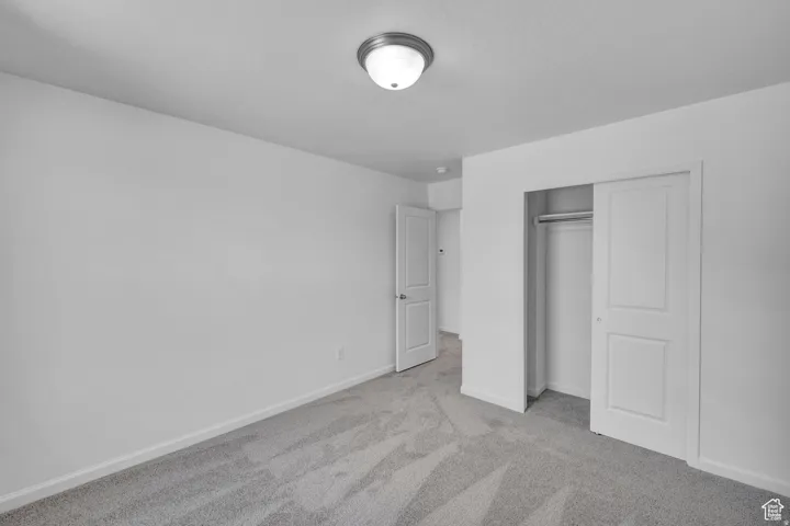 Room featuring neutral gray carpeting and white walls