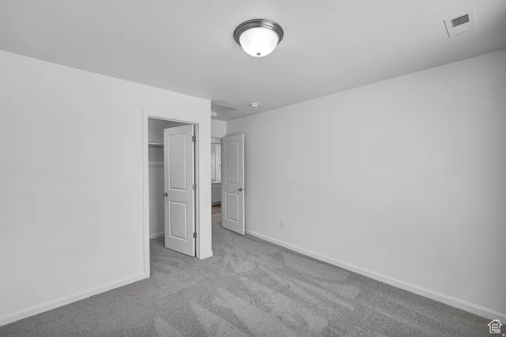 Neutral gray carpeting and white walls