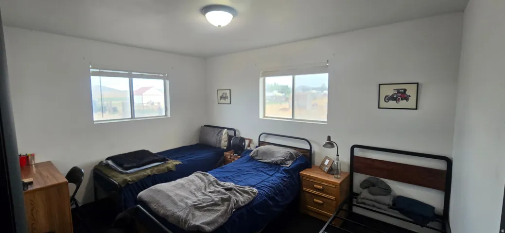 White-painted walls with two windows providing natural light