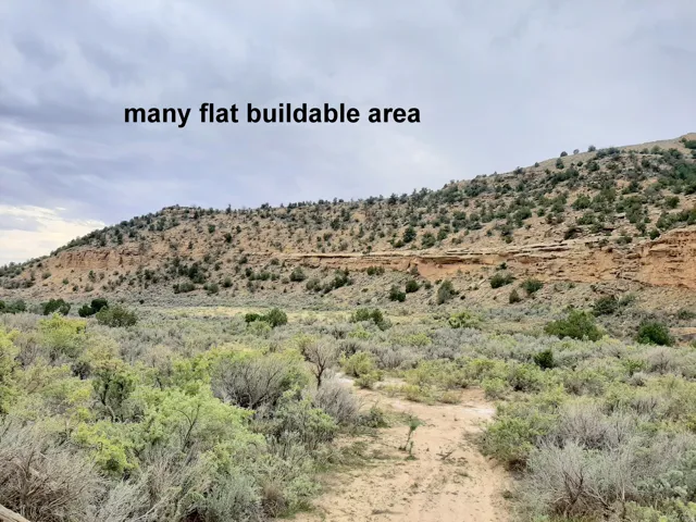9.41 ac. Land Expansive land parcel featuring a flat, open field and rolling hills