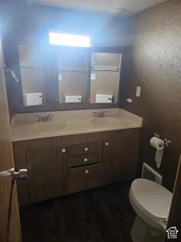 Dual vanity with integrated sinks and white countertops