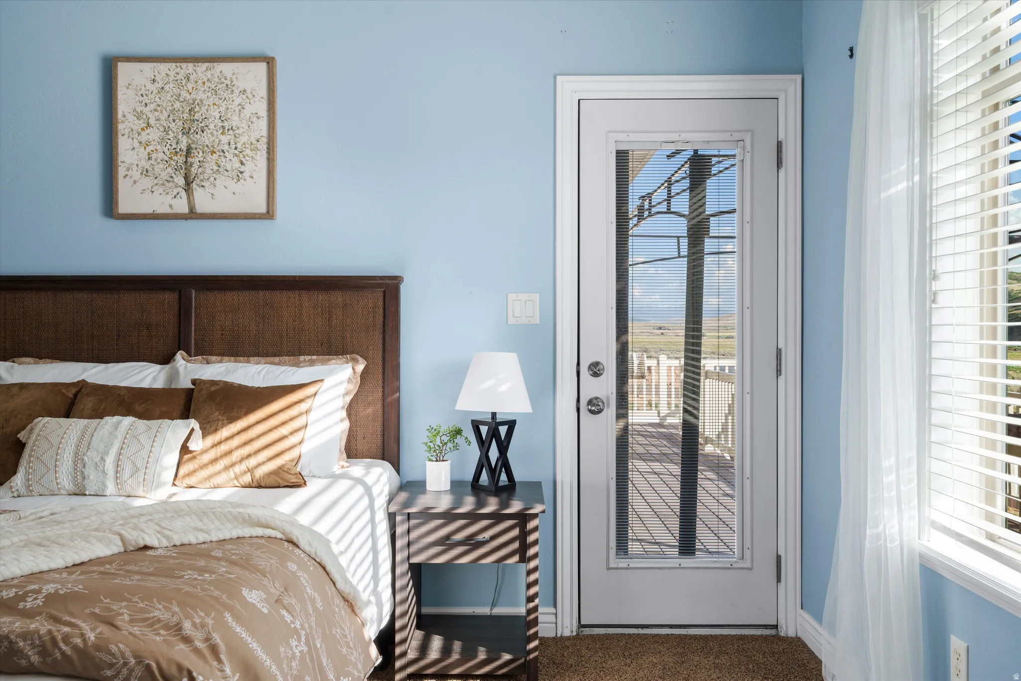 Bedroom featuring a full-light glass panel door providing direct outdoor access