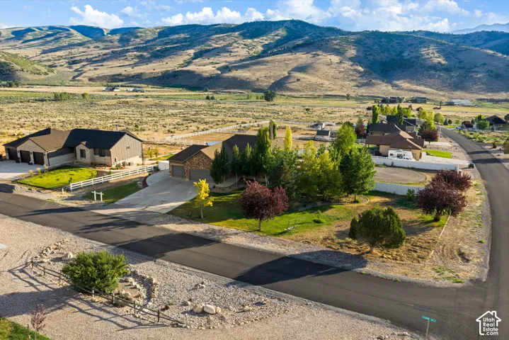 Expansive rural setting with mountain backdrop