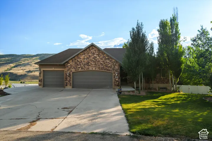 Stone and stucco exterior with a two-car garage