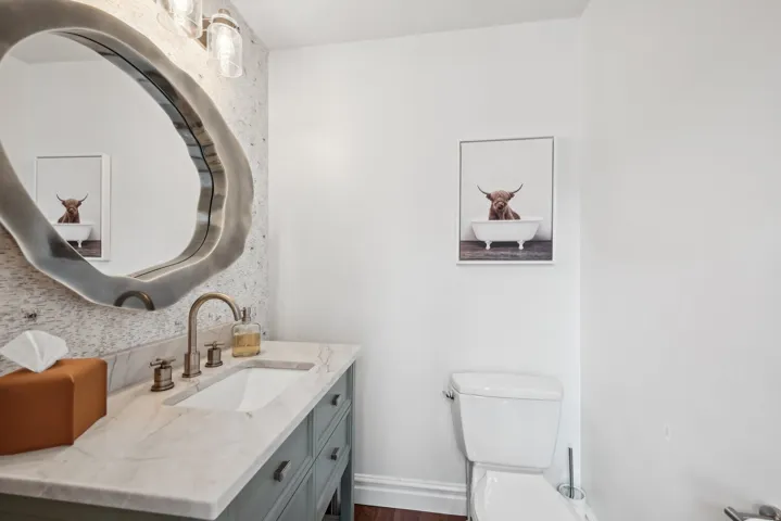 Vanity with a light-toned countertop and an undermount sink