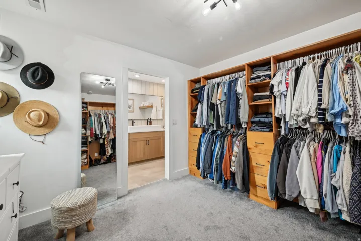 Custom wood-finish closet system with integrated shelving and drawers