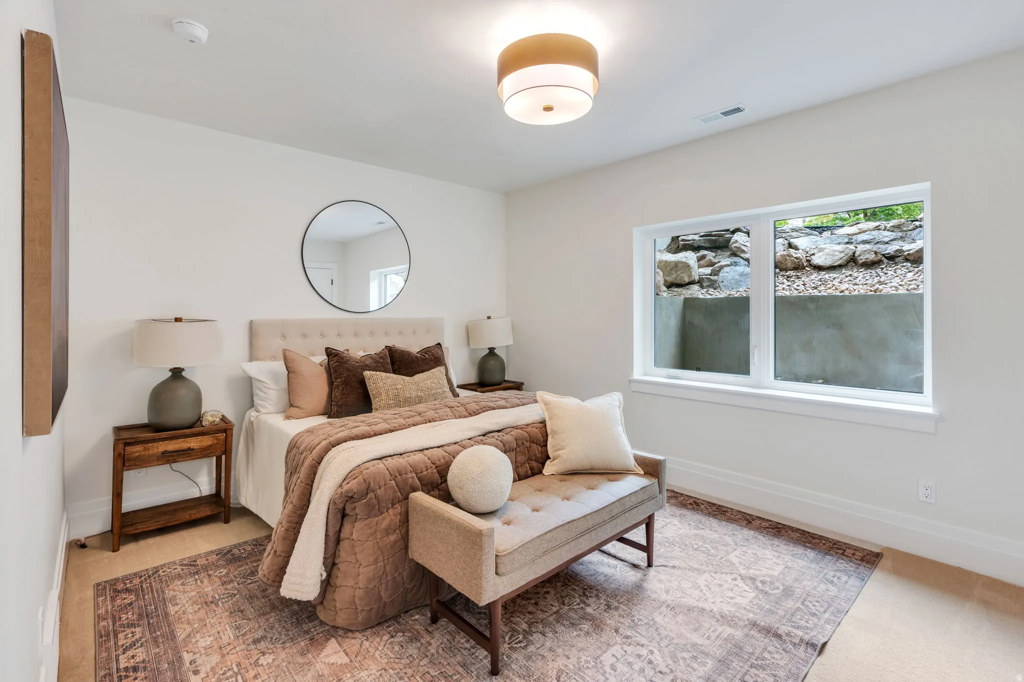 Bedroom featuring light-toned walls, a rectangular window, recessed lighting, and a drum-style ceiling fixture