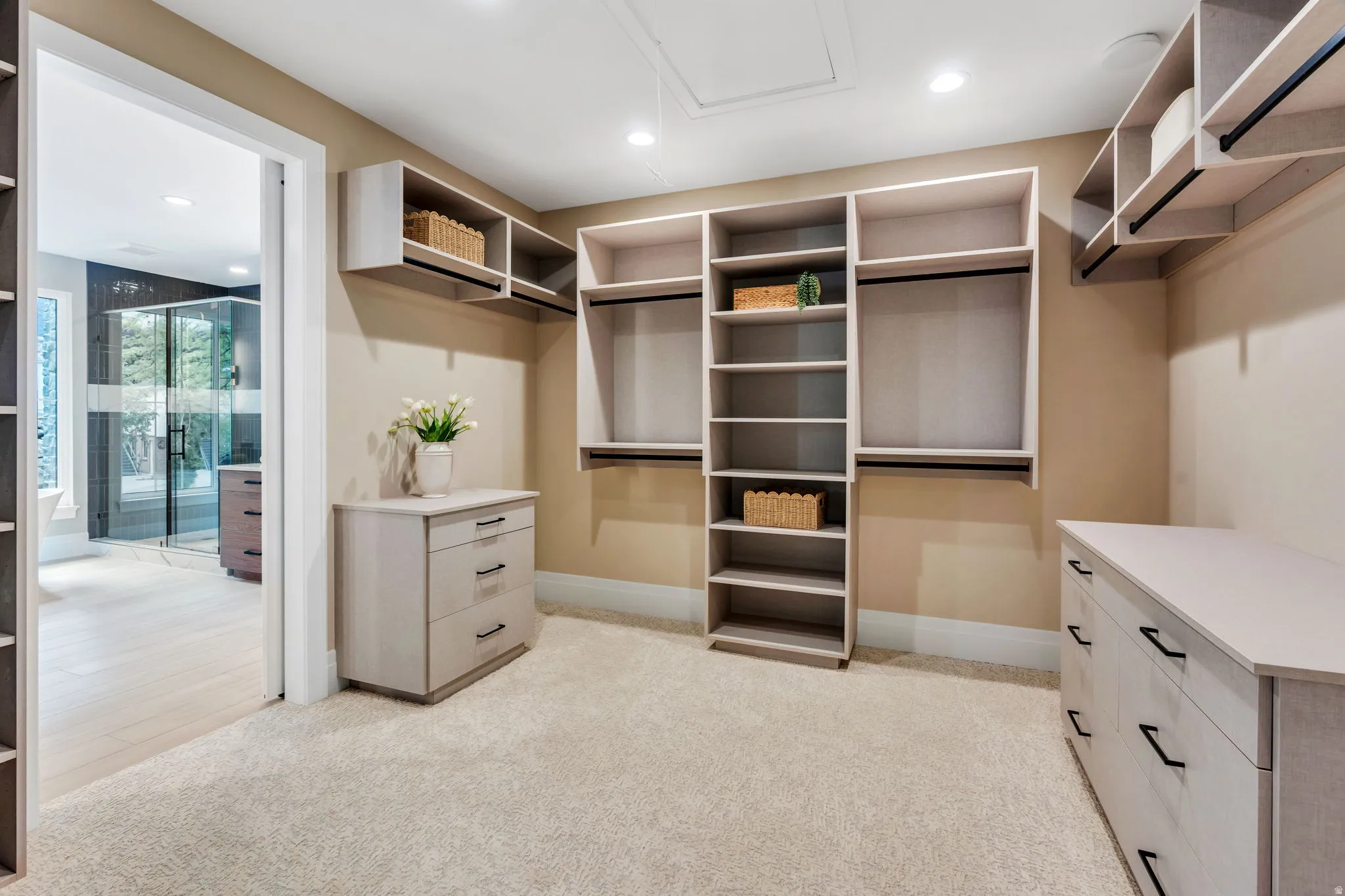 Custom closet system featuring integrated shelving, hanging rods, and drawer storage