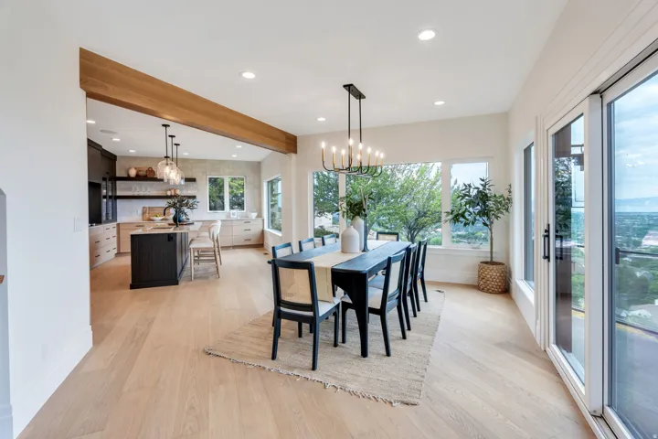 Dining area with light wood-finish flooring
