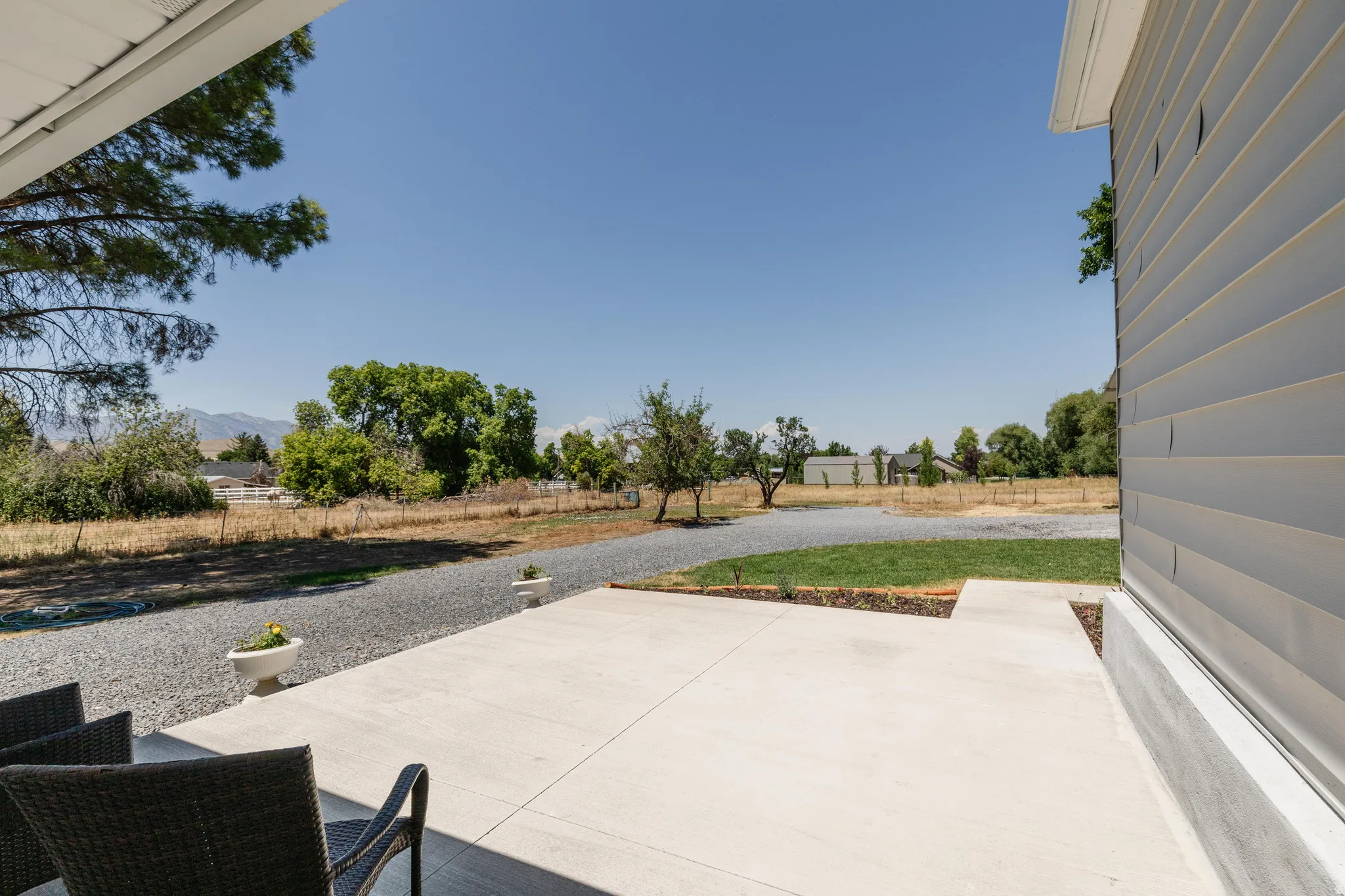 Expansive concrete patio offering outdoor living space