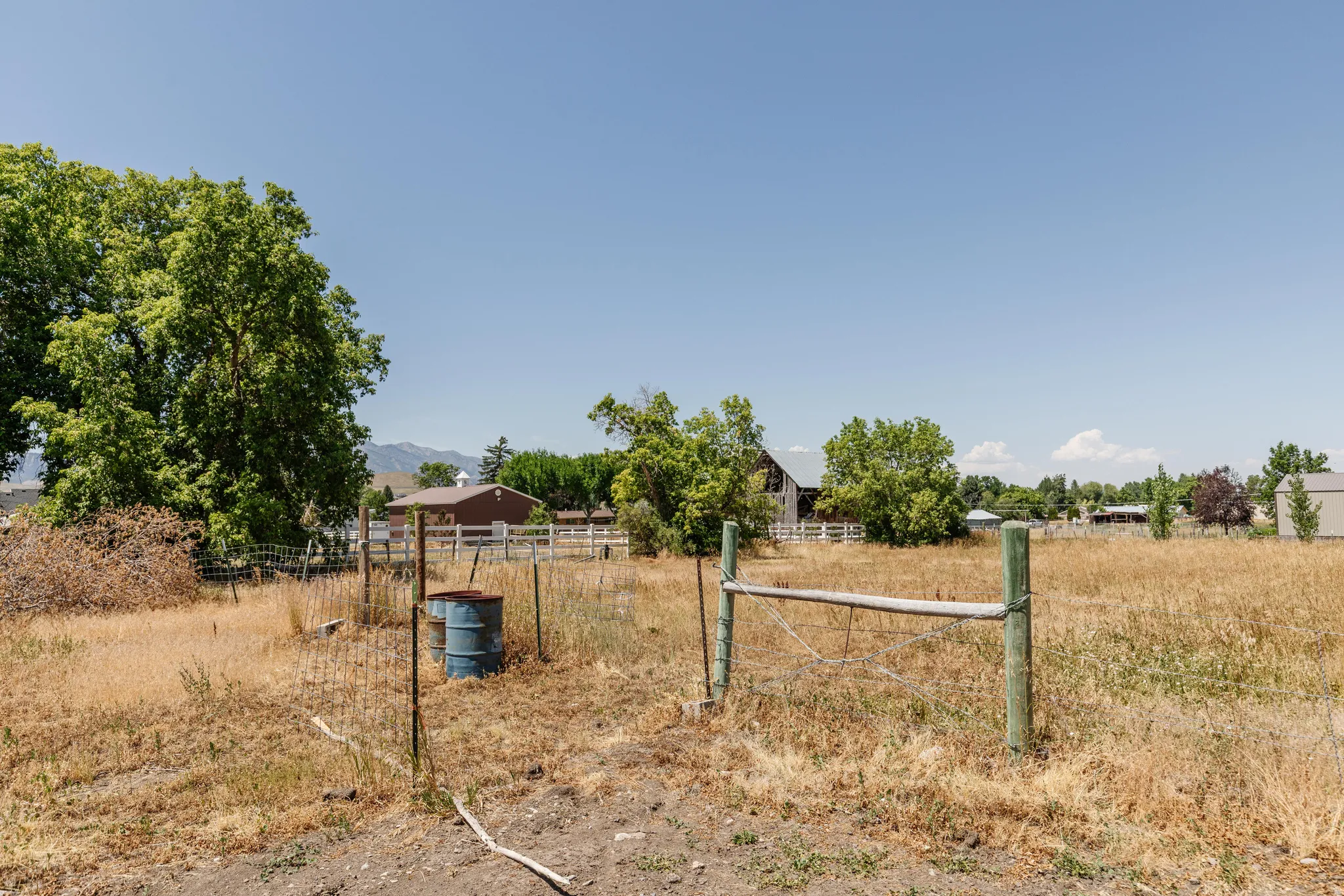 Expansive rural acreage featuring a natural landscape and distant mountain scenery