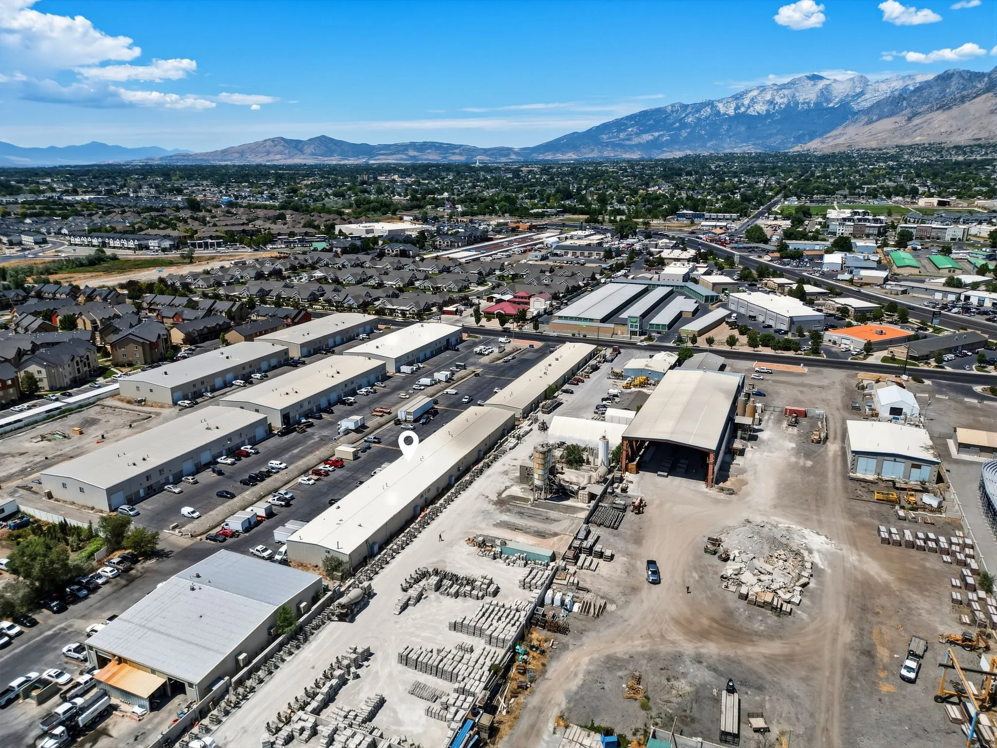Extensive commercial property featuring multiple warehouse buildings with vast parking areas