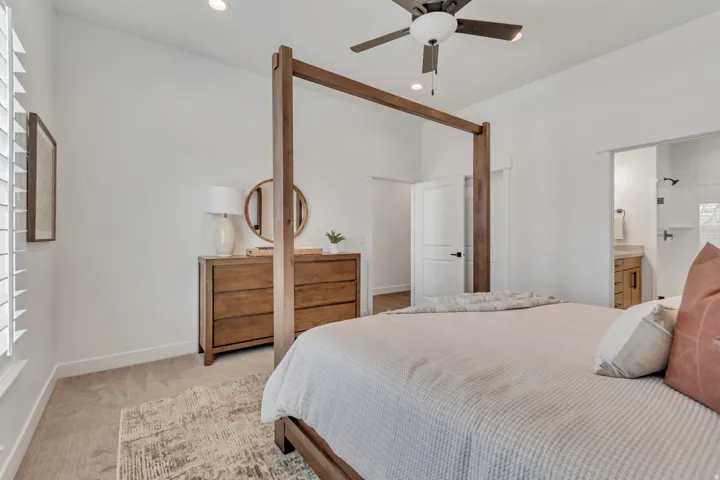Carpeted room featuring a ceiling fan, recessed lighting, and a white door with black hardware