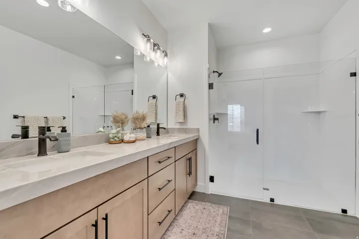 Double vanity with integrated sinks and a light-toned countertop