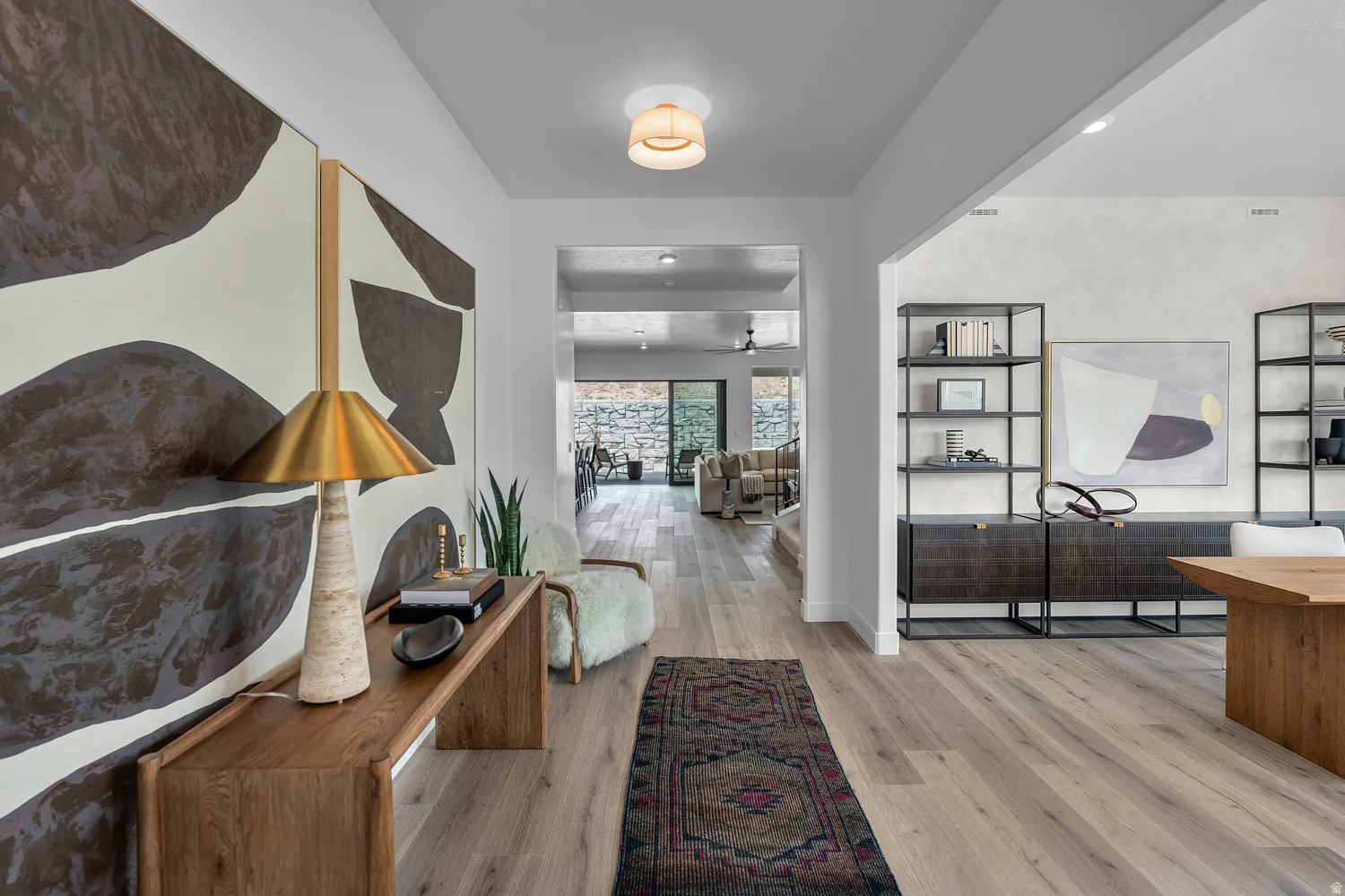 Hardwood-finish flooring extending throughout, framed by light-toned walls