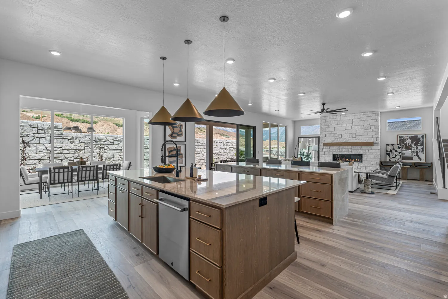 Open-concept living space with light wood-finish flooring
