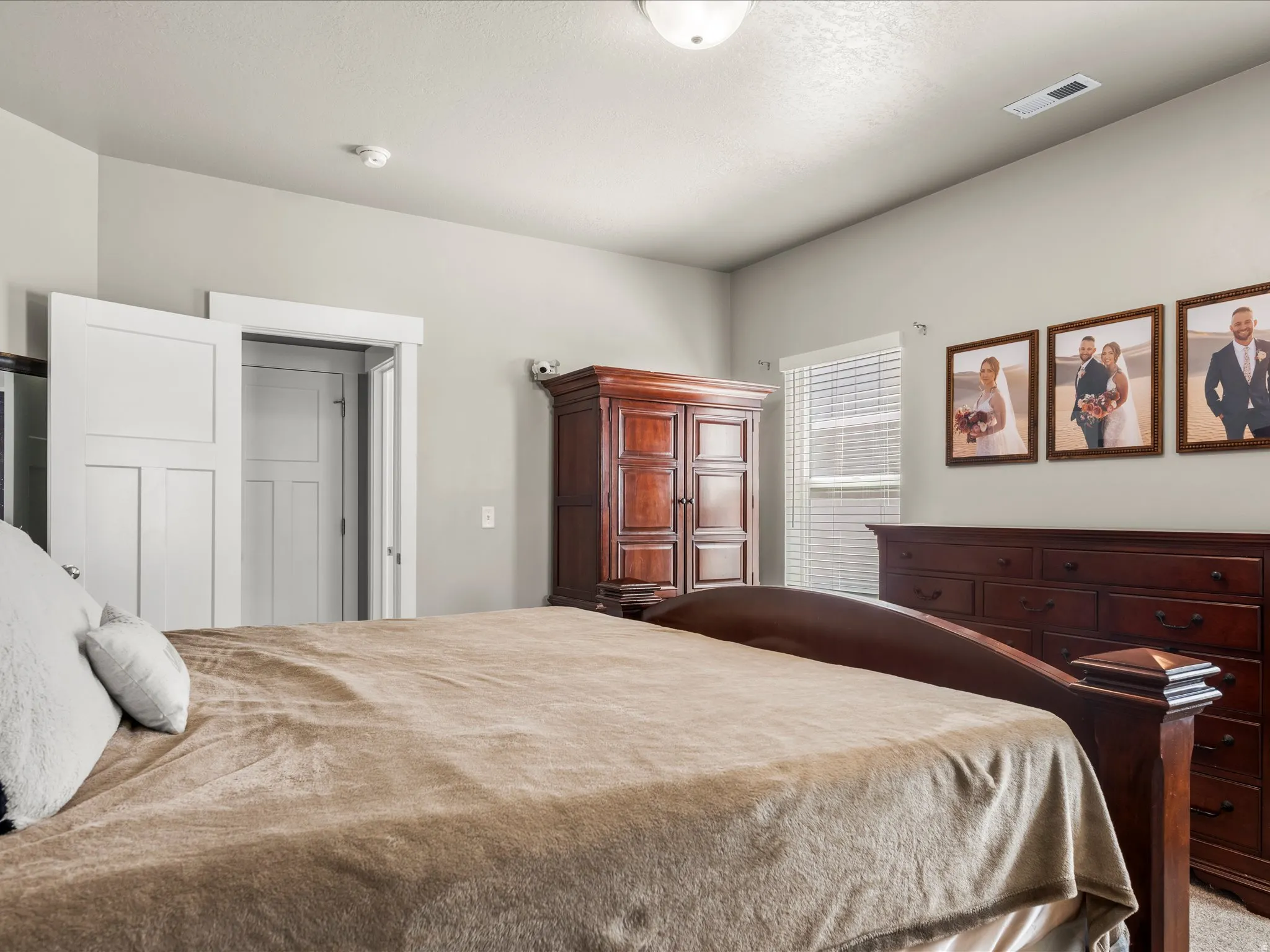 Spacious room featuring light gray walls, white trim, and a ceiling-mounted light fixture