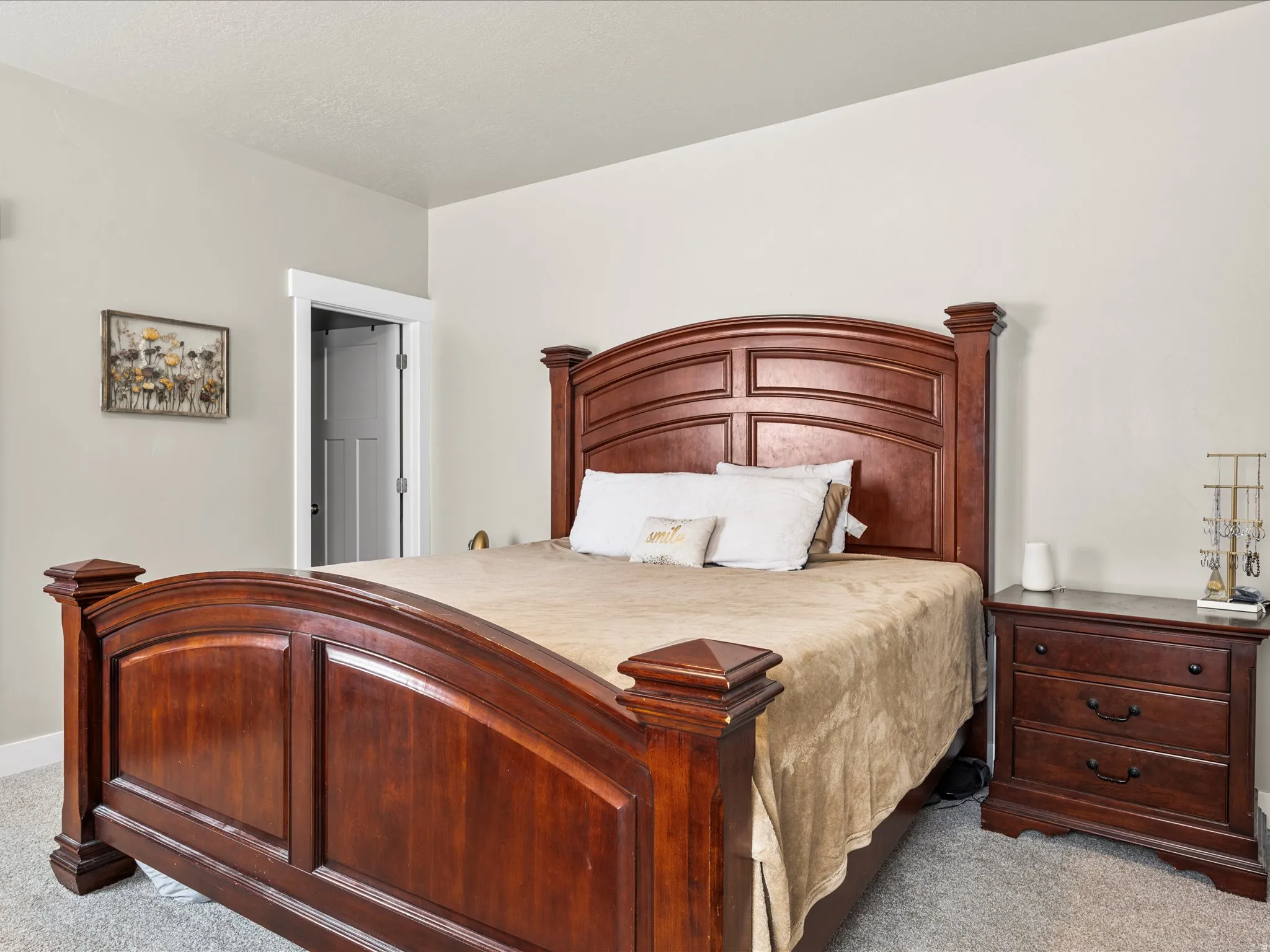 Light gray wall paint, white trim, and gray carpet flooring