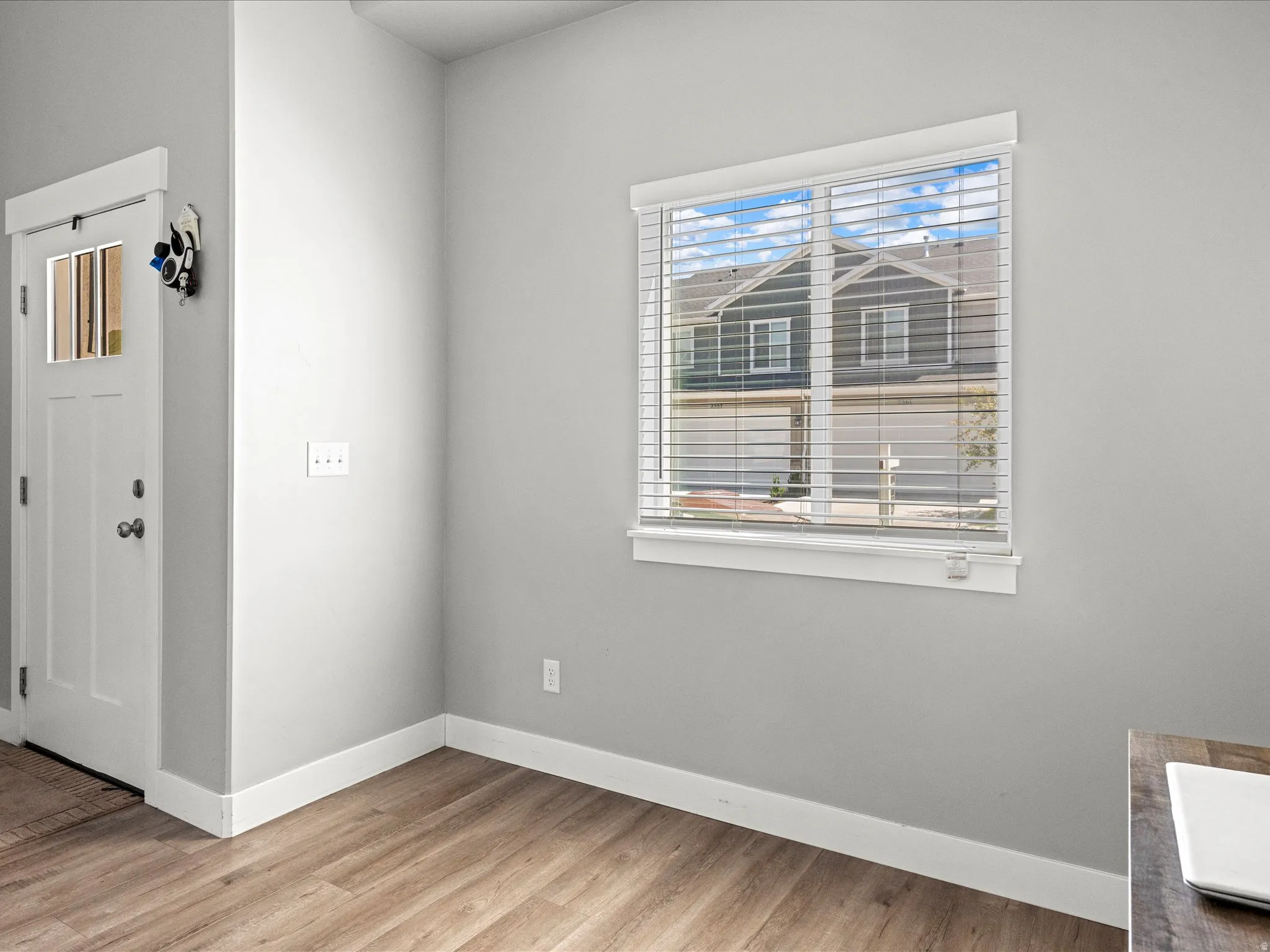 Interior space featuring wood-finish flooring and light gray walls