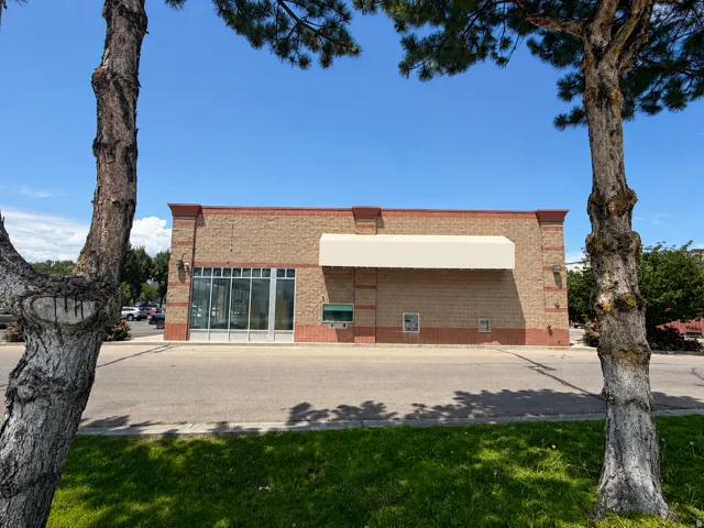 Commercial building with a brick facade and decorative stone accents