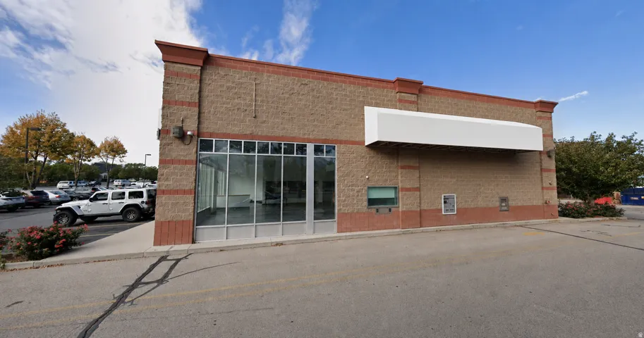 Commercial building with a brick facade and large storefront windows