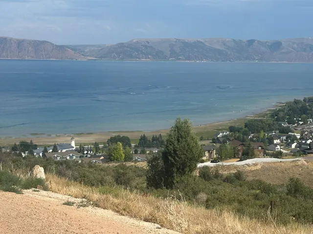 Expansive water body with surrounding mountainous terrain