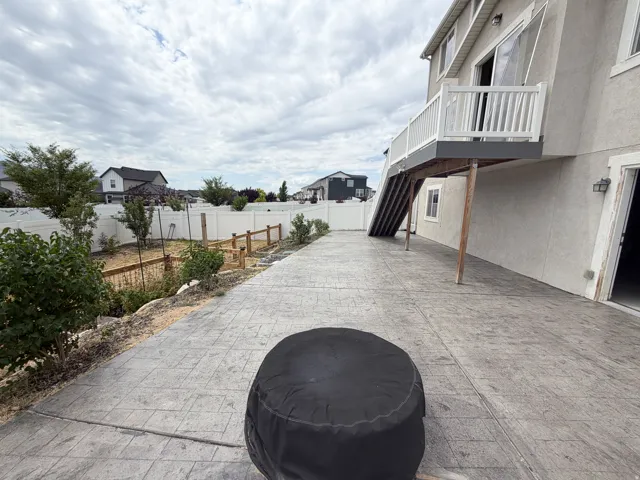 Expansive stamped concrete patio with direct access to the interior