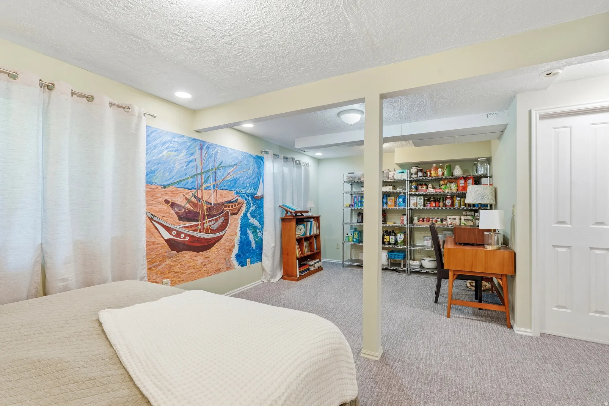 Carpeted room featuring recessed lighting and a white paneled door