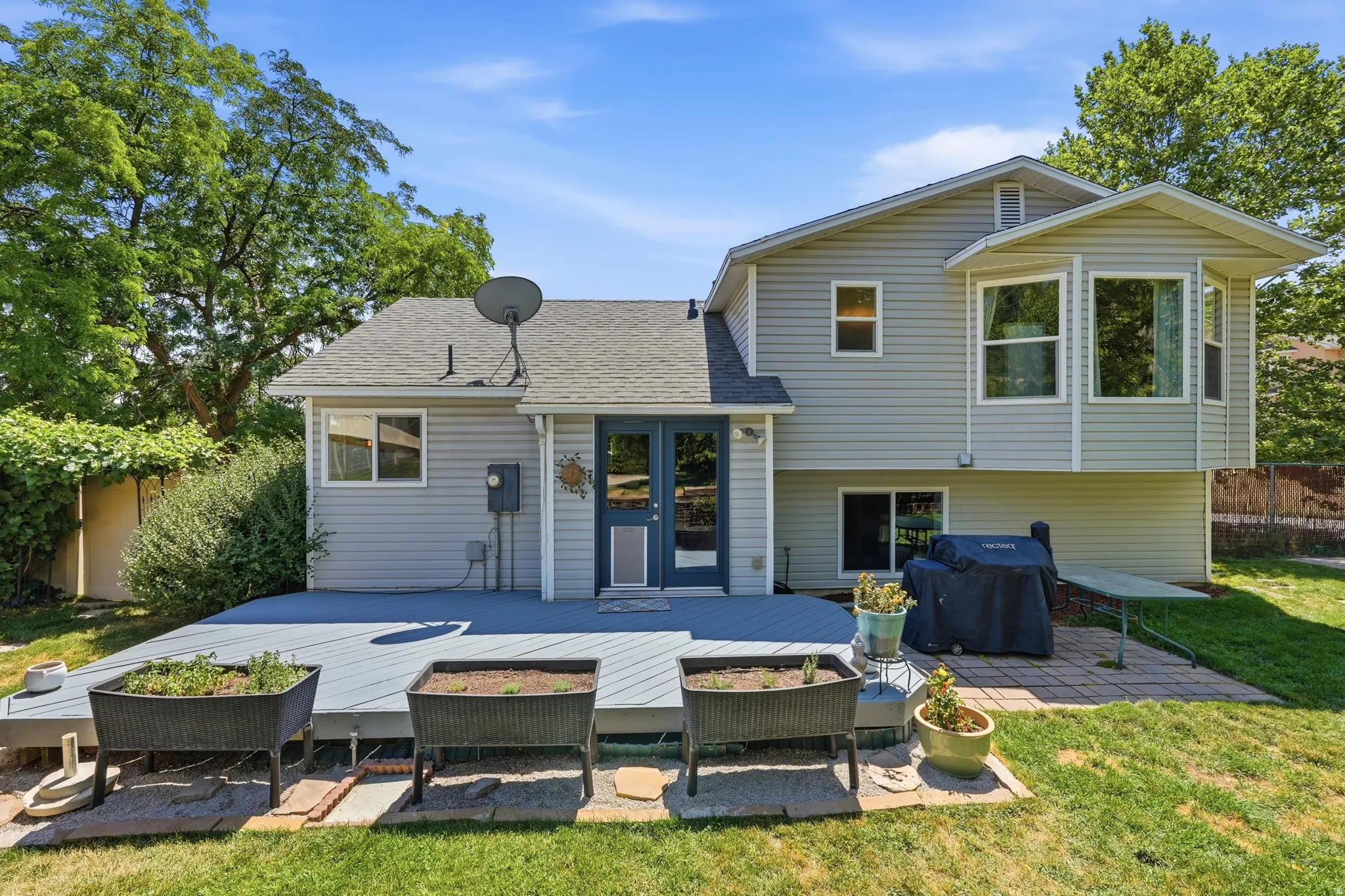 Expansive rear deck featuring gray wood-finish decking