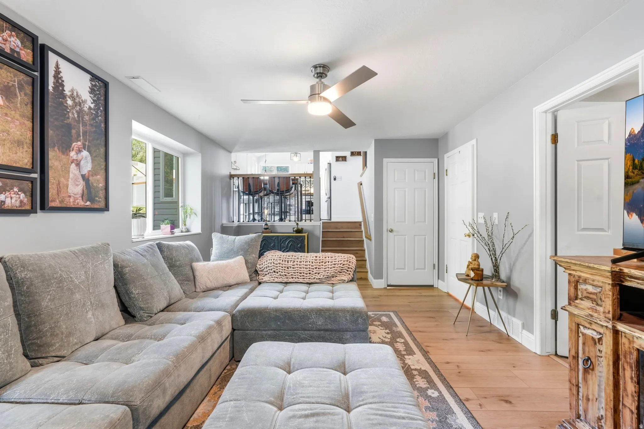 Spacious living area featuring recessed lighting, and a ceiling fan