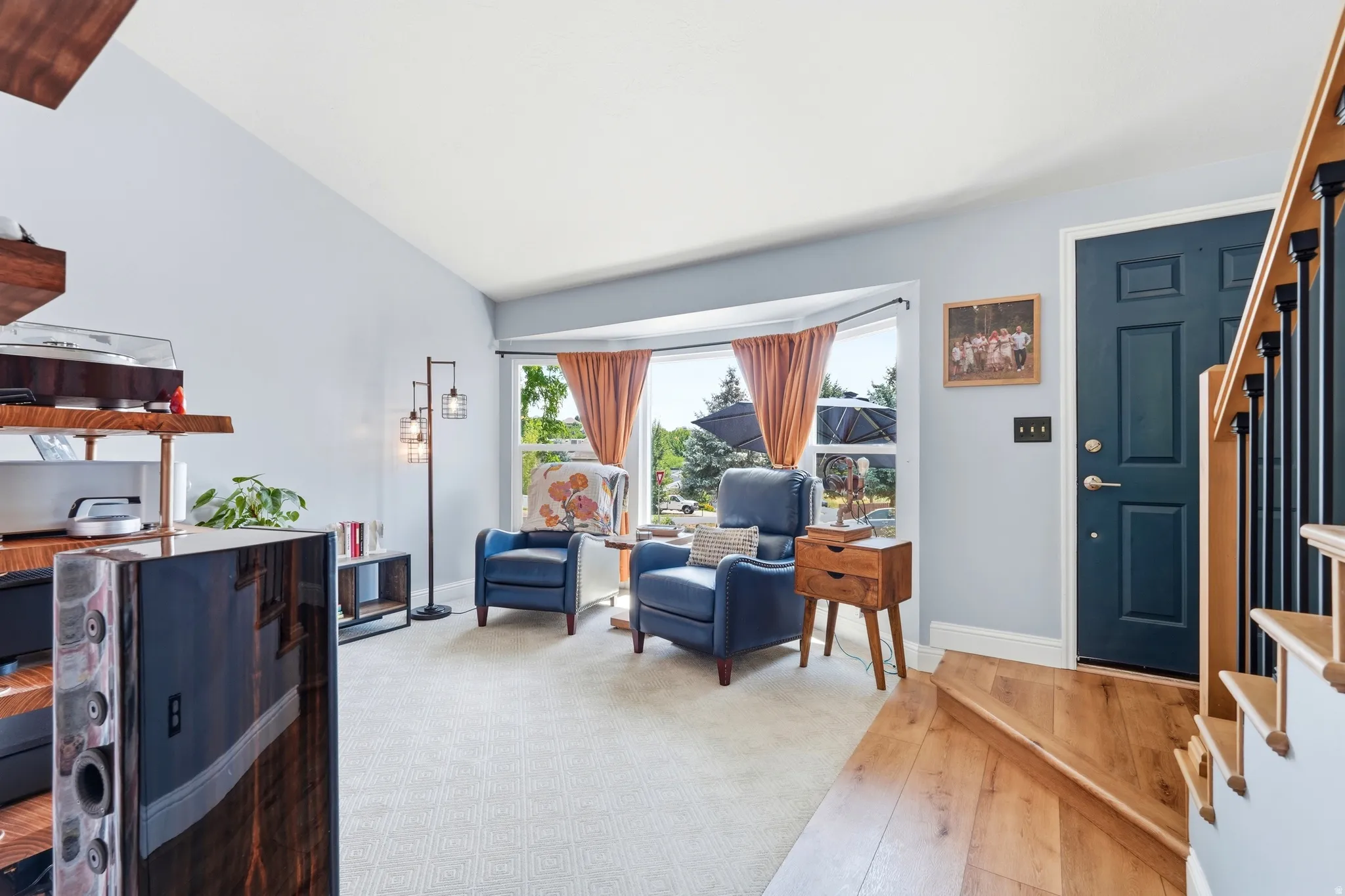 Entryway and formal living room with bay windows, and LVP flooring