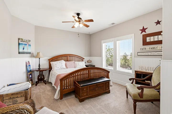Bedroom 3 off the Loft with Wainscoting and a Ceiling Fan, Overlooks the Front of the Home