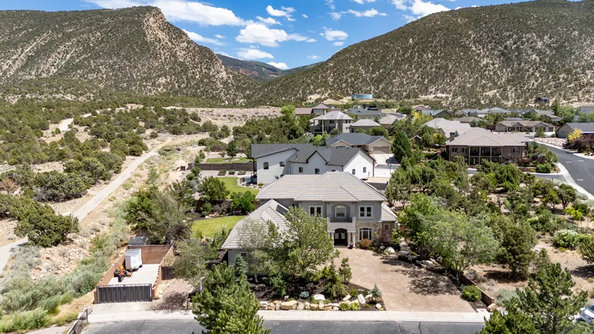 Aerial View Showcasing the Home, Privacy and Exceptional Fiddlers Canyon Mountain Setting, with Multi-Car Driveway, and Mature Landscaping
