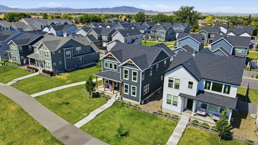 Modern residential development featuring a collection of contemporary homes with varied siding colors and rooflines