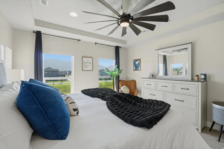 Recessed ceiling with an integrated modern ceiling fan featuring multiple blades
