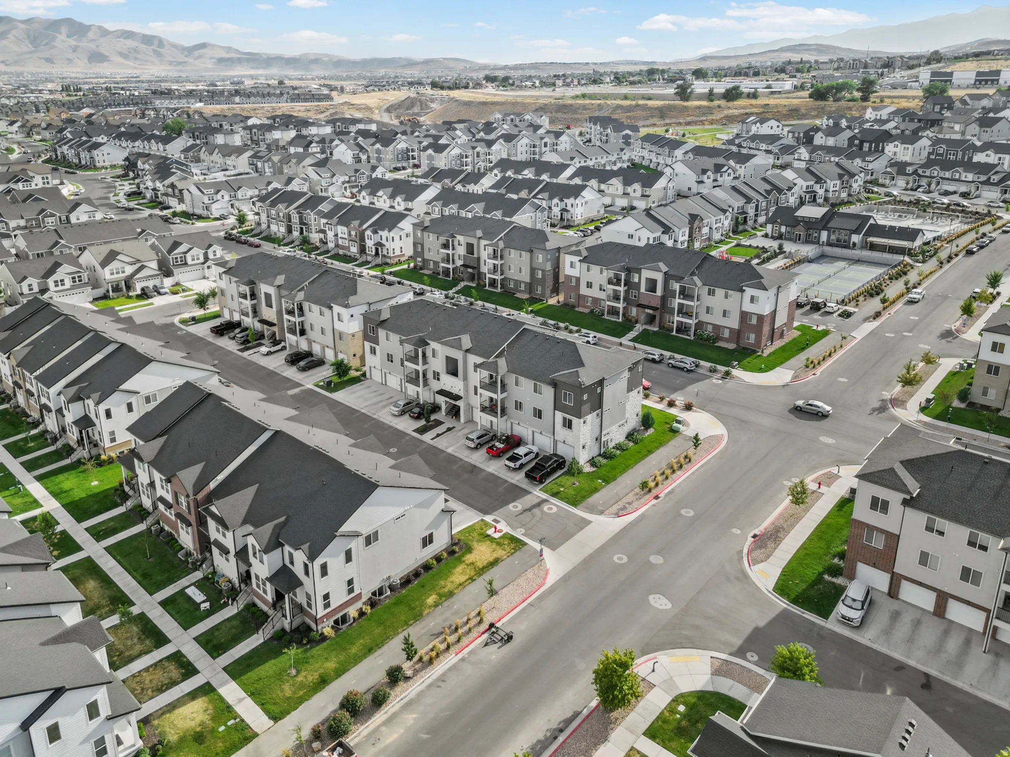 Expansive residential development featuring a variety of multi-story townhomes and apartment buildings