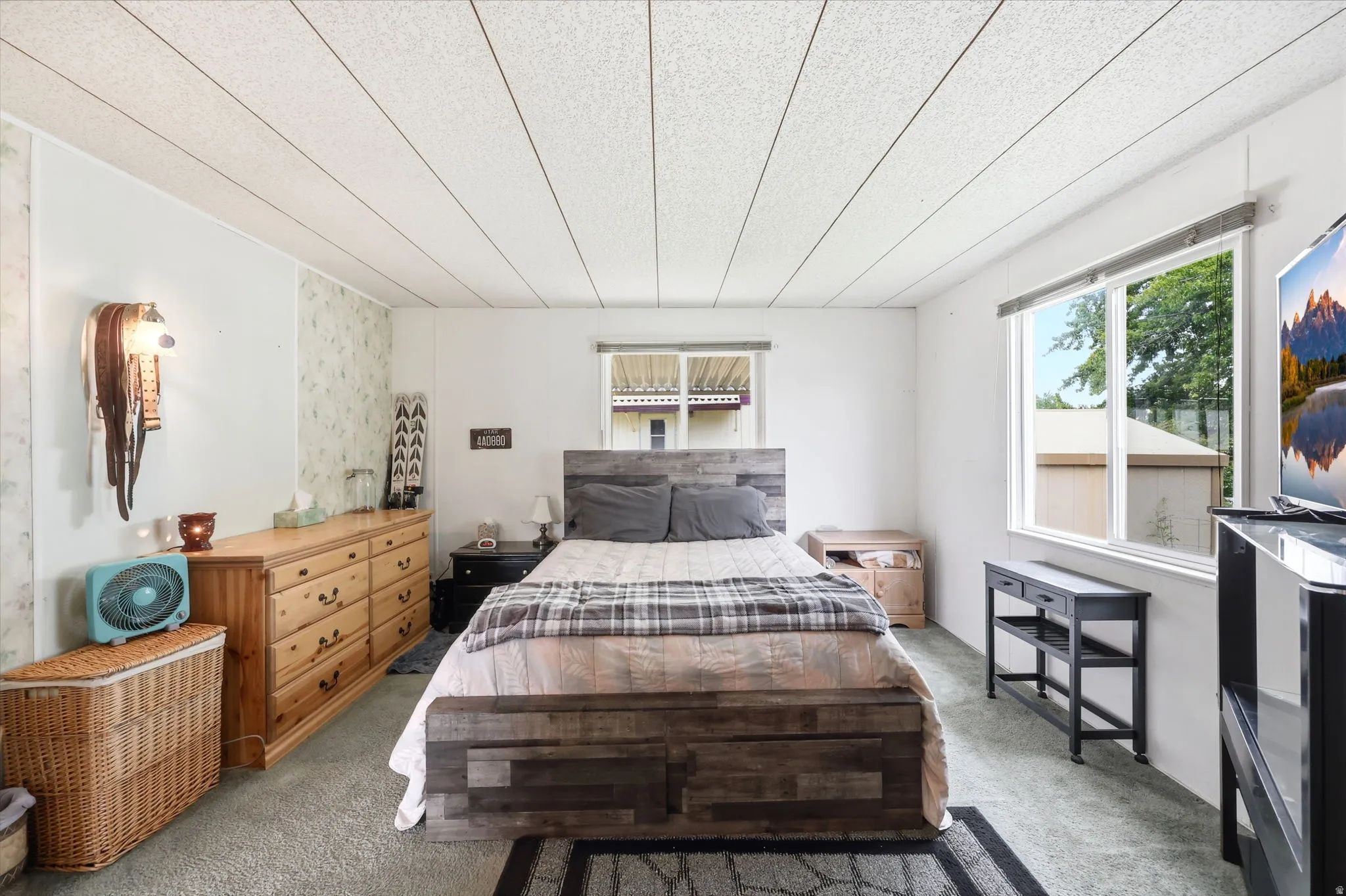 Bedroom featuring light gray carpeting and white walls