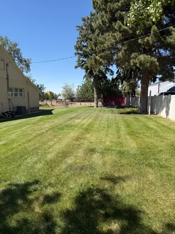 Spacious rear yard with expansive lawn