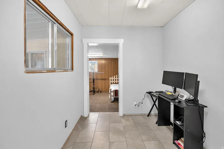 Neutral-toned tile flooring throughout