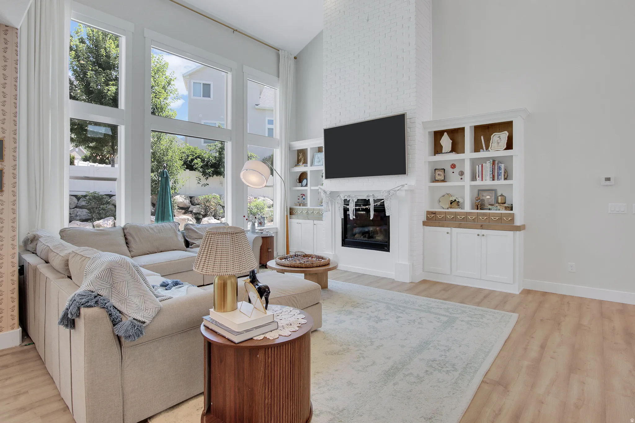 High ceilings complement the light wood-finish flooring