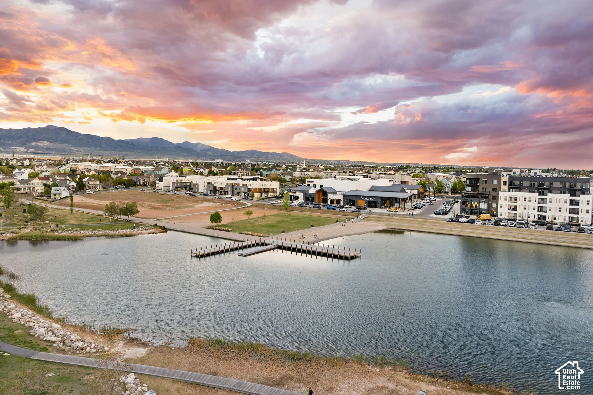 Expansive community lake with a central pier and dock system