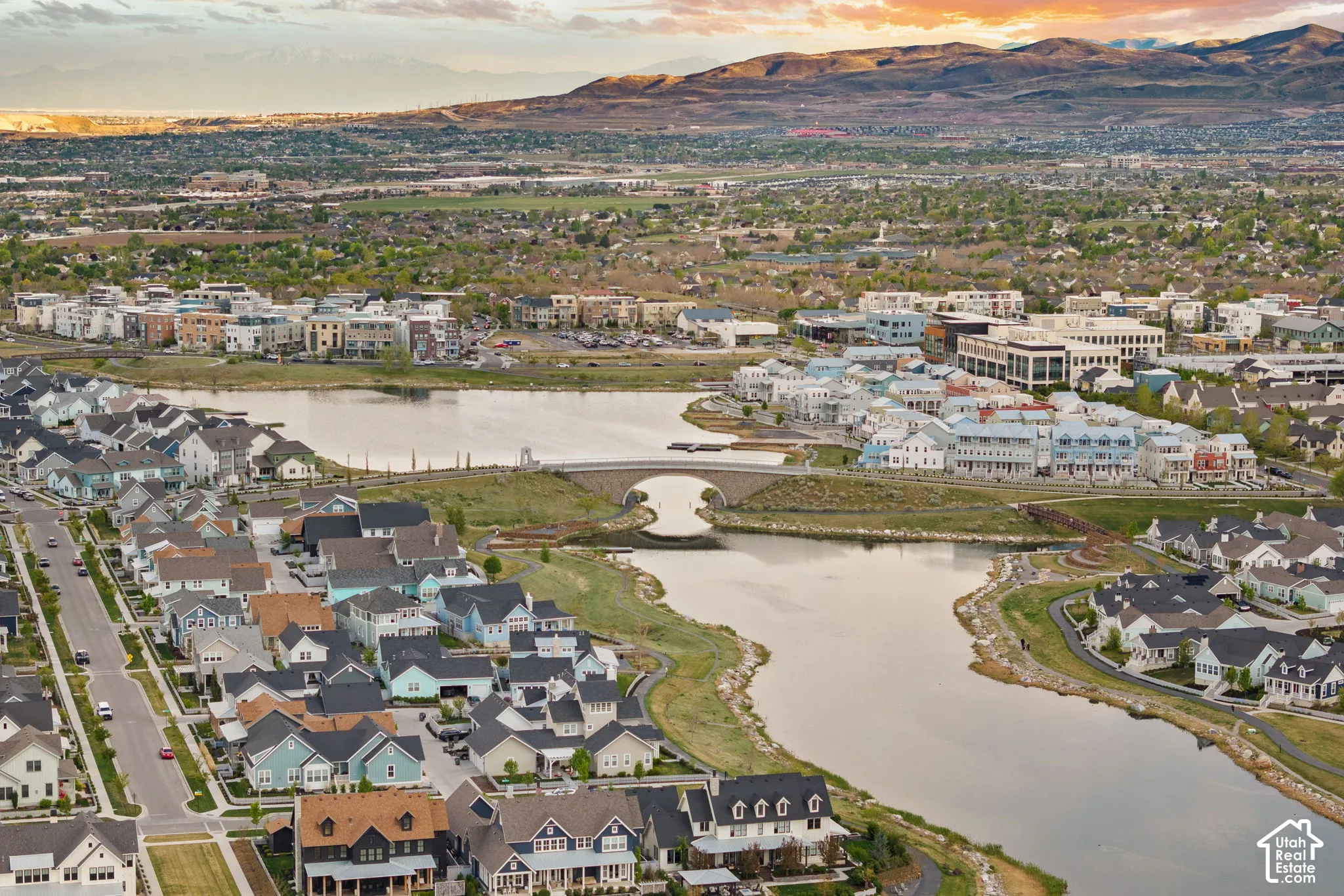 Expansive aerial perspective showcasing a master-planned community with residential properties and commercial buildings