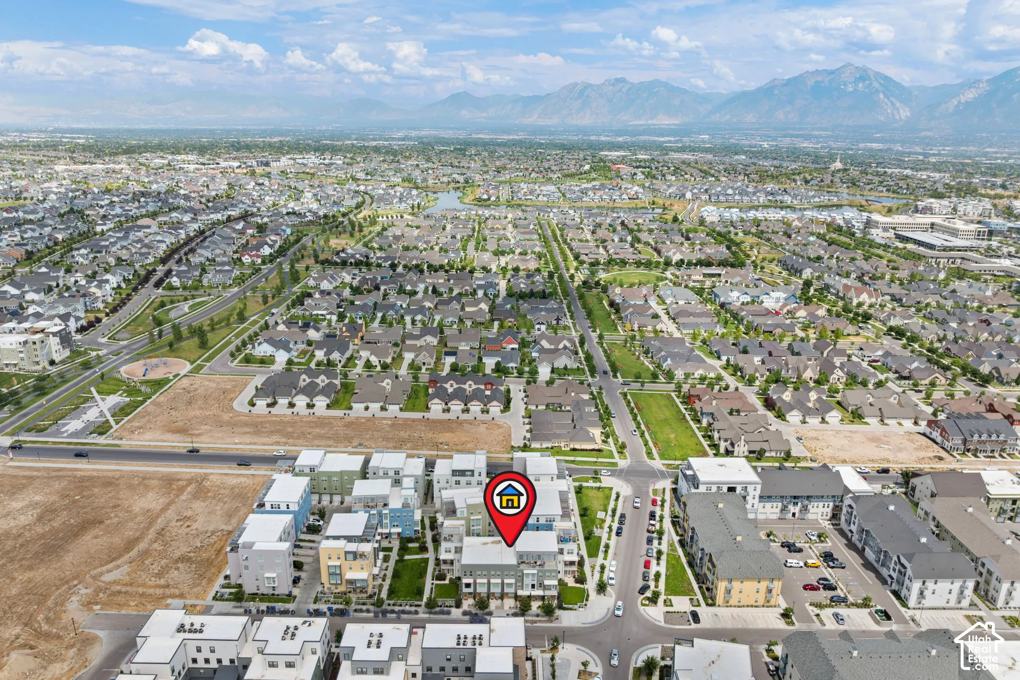 Aerial perspective showcasing the residential community with mountain scenery
