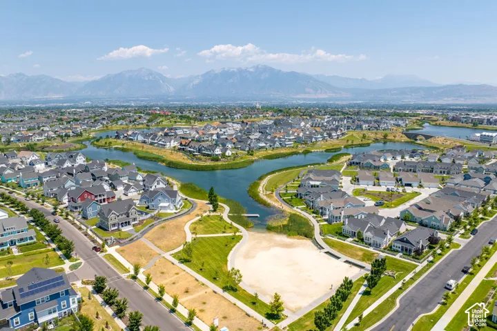 Aerial perspective showcasing a residential community with a central waterway