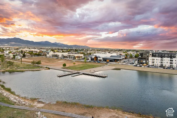 Expansive community lake with a central pier and dock system