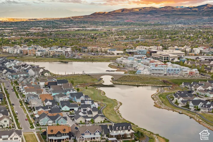 Expansive aerial perspective showcasing a master-planned community with residential properties and commercial buildings