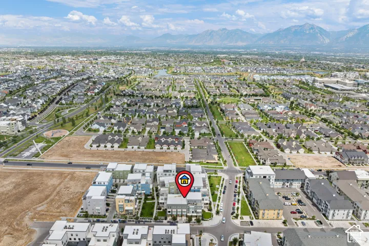 Aerial perspective showcasing the residential community with mountain scenery