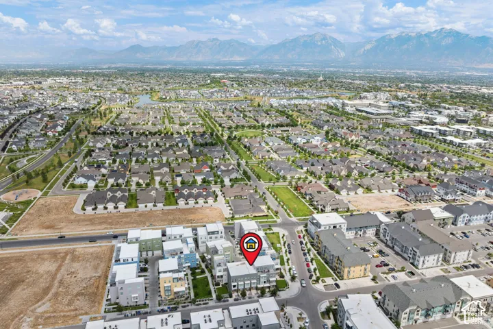 Aerial perspective showcasing the residential development, featuring a mix of multi-story townhomes and single-family residences